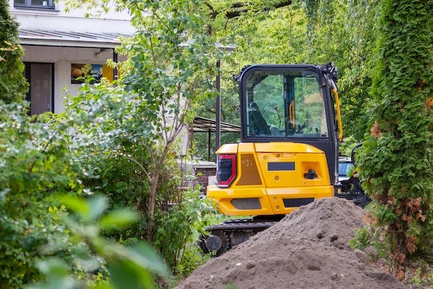 A mini excavator in landscaping tasks