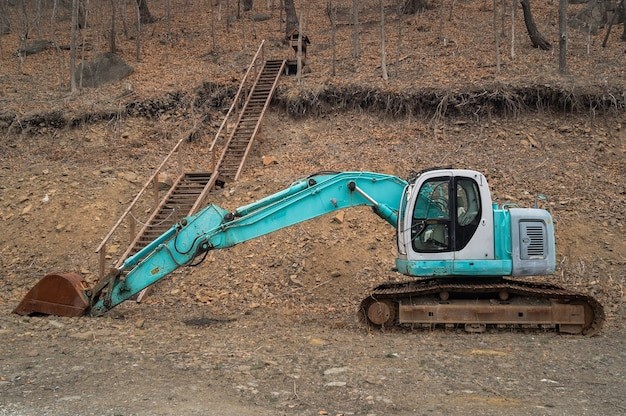 A mini excavator with a bucket attachment
