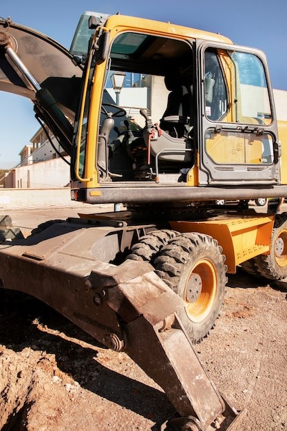 A compact wheeled excavator with attachments